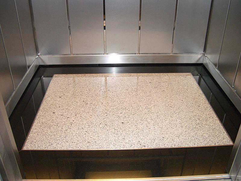 Ốp đá Granite sàn thang máy mang lại bề mặt sáng bóng, chống trầy xước và bền bỉ với thời gian