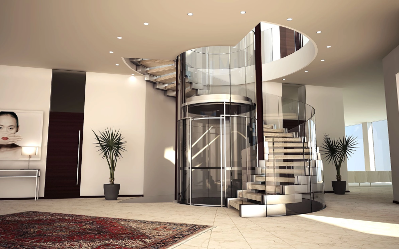 Thang máy kính trụ tròn thiết kế sang trọng cùng với cầu thang bộ là điểm nhấn đặc biệt trong kiến trúc ngôi nhà